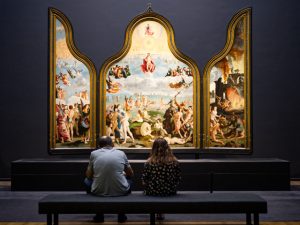The Rijksmuseum is full of paintings, which is located in Amsterdam.
