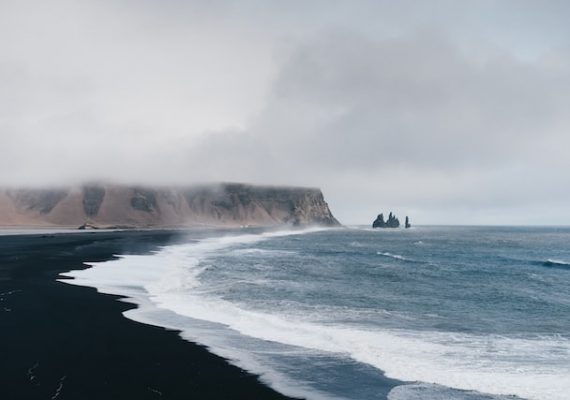 Black sand beach, Iceland where we go in Cheap Iceland trips from Netherlands.